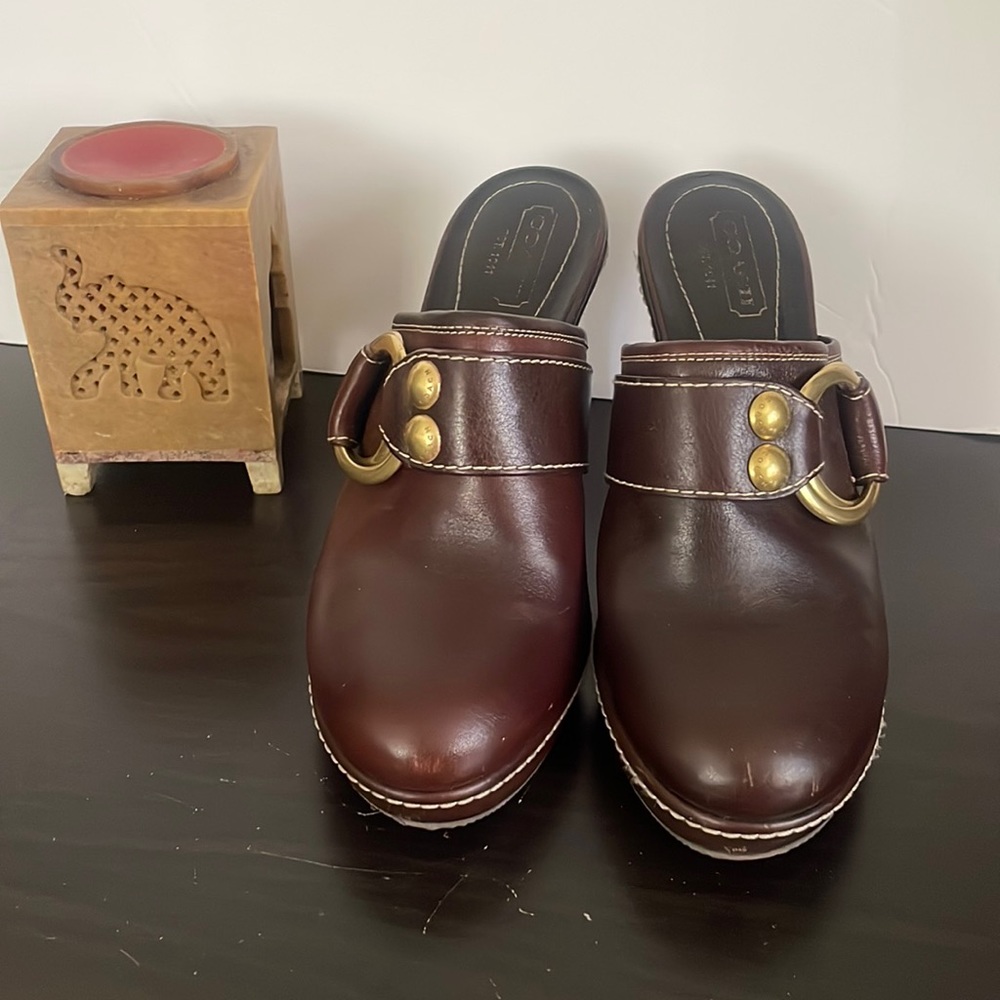 Authentic leather buckle Coach chocolate wedges. 4-1/2 inch heel. 1inch platform